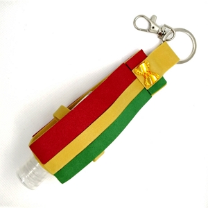 Bolsa riscas e laço com frasco para alcool gel